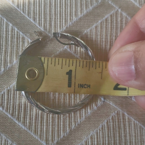 One Italian 14 karat gold white gold earrings from Costco . - Picture 4 of 6